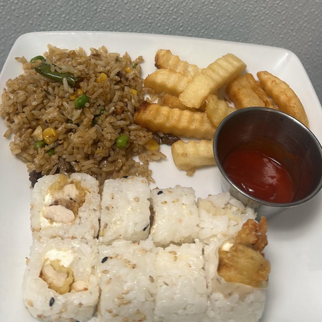 Sushi combo plate with fried rice and crinkle fries