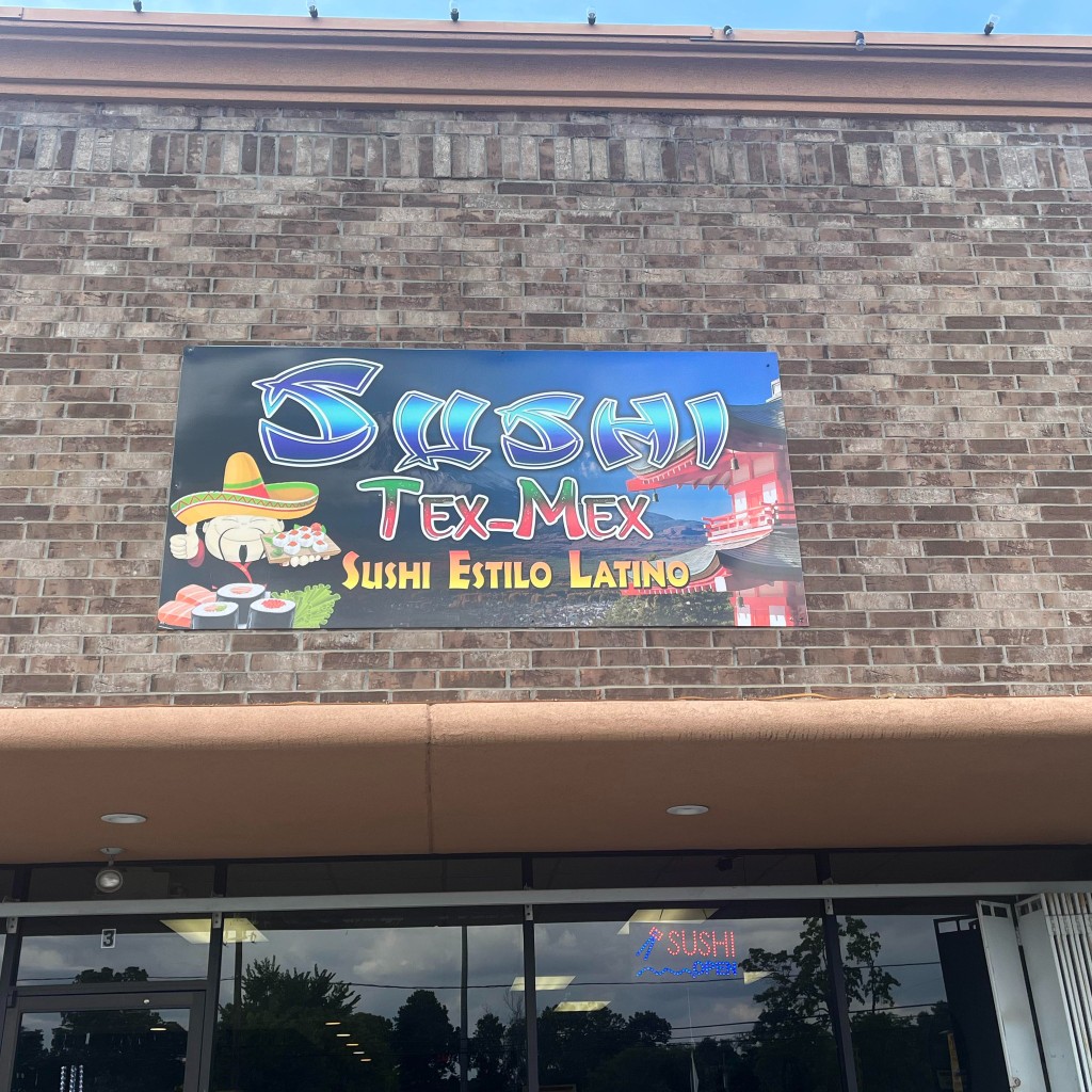 Sushi Tex-Mex storefront and sign at Aldine Mail Route